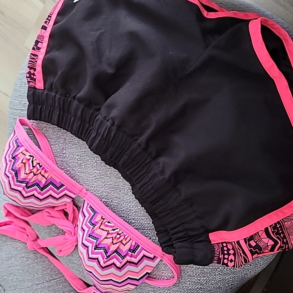 Pink and black top and shorts bottom swimming set
